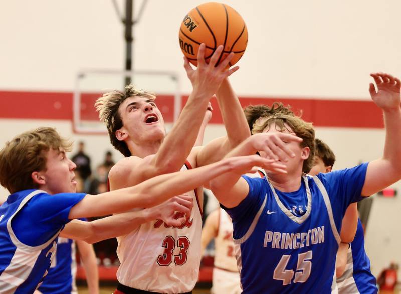 Hall's Braden Curran shoots between Princeton's Jackson Mason (left) and Luke Smith at the Colmone Classic on Friday night.
