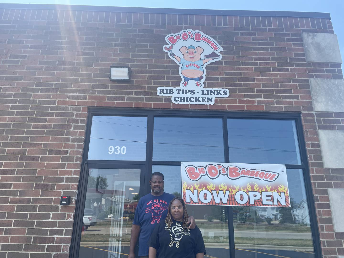 Owners Alando and Valerie Farmer pose Monday, July 7, 2025, outside the new storefront for Big O's Barbecue at 930 Pappas Drive in DeKalb.