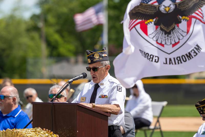 Phil Valle of the Peru Honor Guard speaks at the annual Memorial Day service on Monday, May 26, 2025 at Washington Park in Peru.