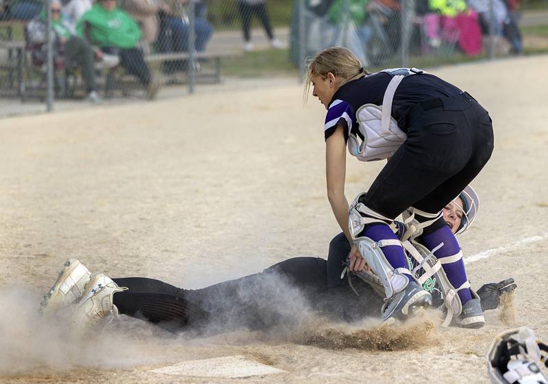 Rock Falls’ Madisyn Eikenberry is tagged out at home against Dixon Thursday, May 7, 2026.