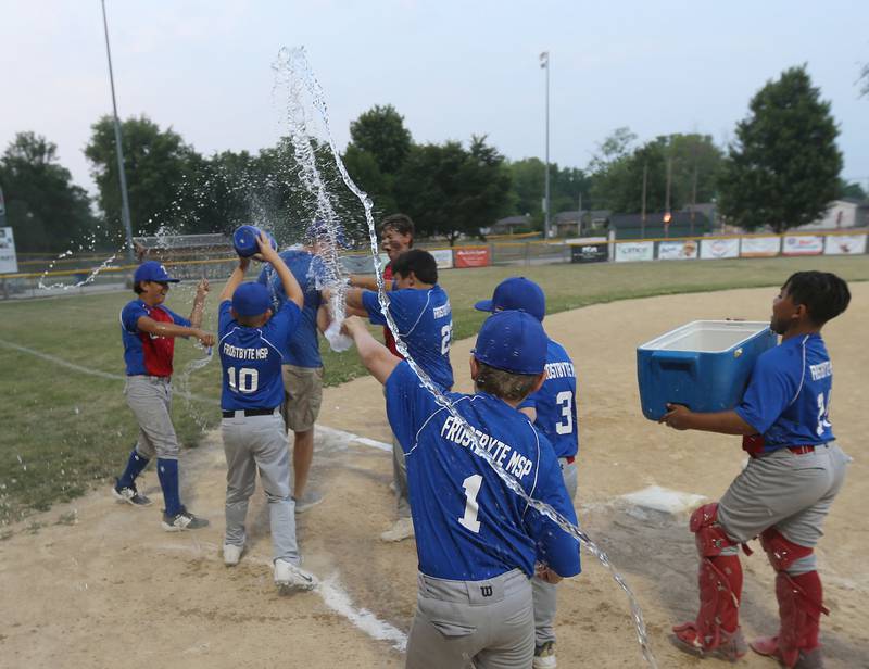 Members of the Frostbyte MSP Rangers spray water on head coach Josh Johnson after winning the Ottawa Little League baseball (12U) City Championship 11-3 over the Thrush Sanitation Red Sox on Friday, June 23, 2023 at Varland Park in Ottawa.