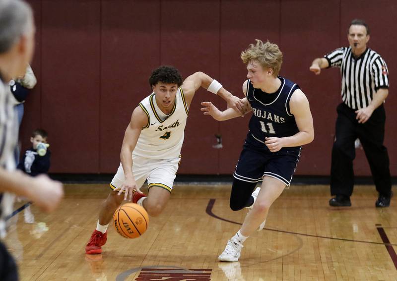 Crystal Lake South's Anthony Demirov pushes the ball up the court against Cary-Grove's Landon Nawracaj during the IHSA Class 3A Prairie Ridge Regional championship basketball game on Friday, Feb. 28, 2025, at Prairie Ridge High School in Crystal Lake.
