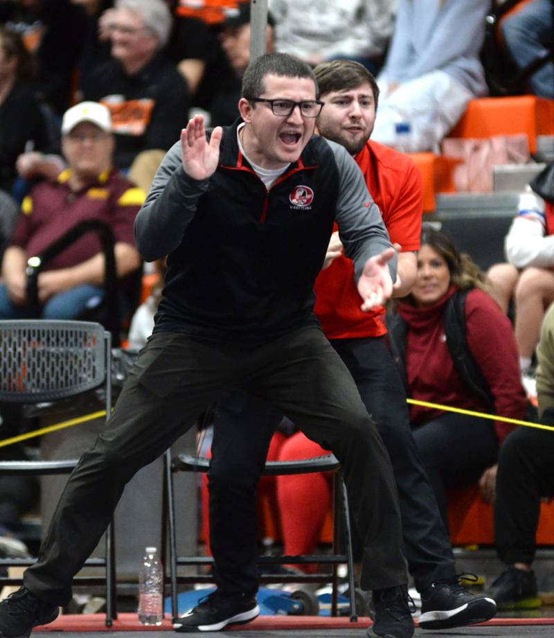 Oregon wrestling coach Justin Lahman cheers on Levi Benton in the 138-pound title match at the 1A Byron Regional on Saturday, Feb. 8, 2025. Benton won the match to advance to the Oregon Sectional.