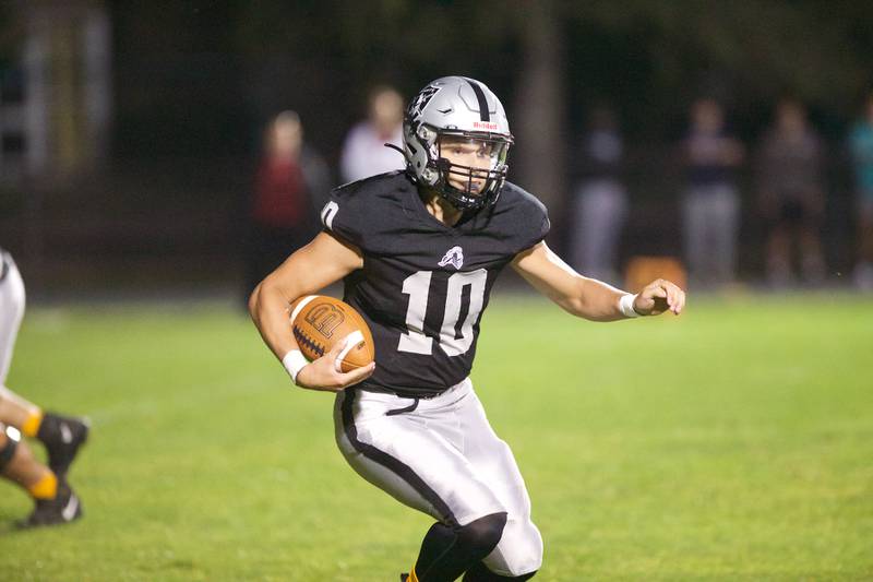 Kaneland's Troyer Carlson runs for a gain against Morris on Friday, Sept. 8, 2023 in Maple Park.