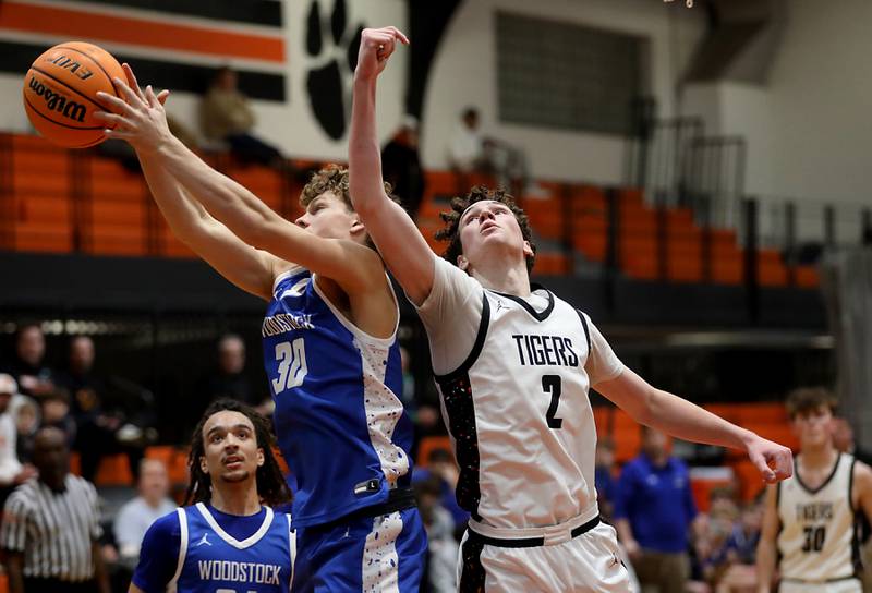 Woodstock's Ty Steponitis battles for a rebound against Crystal Lake Central's Danny Spychala during a nonconference boys basketball game on Monday Jan. 5,  2026, at Crystal Lake Central School.