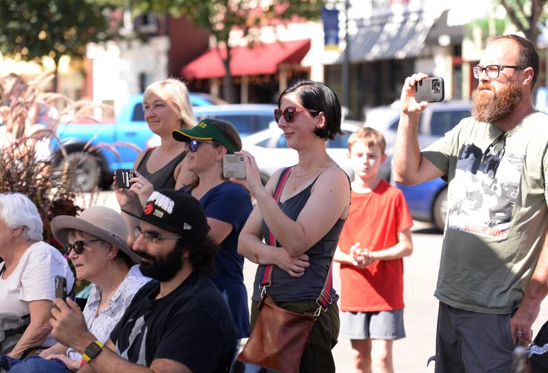 Parents and family of Jerry Evans School of Music in Wheaton watch while members of the school perform downtown Wheaton during the Music on Main event held Saturday, Sept. 21, 2024.
