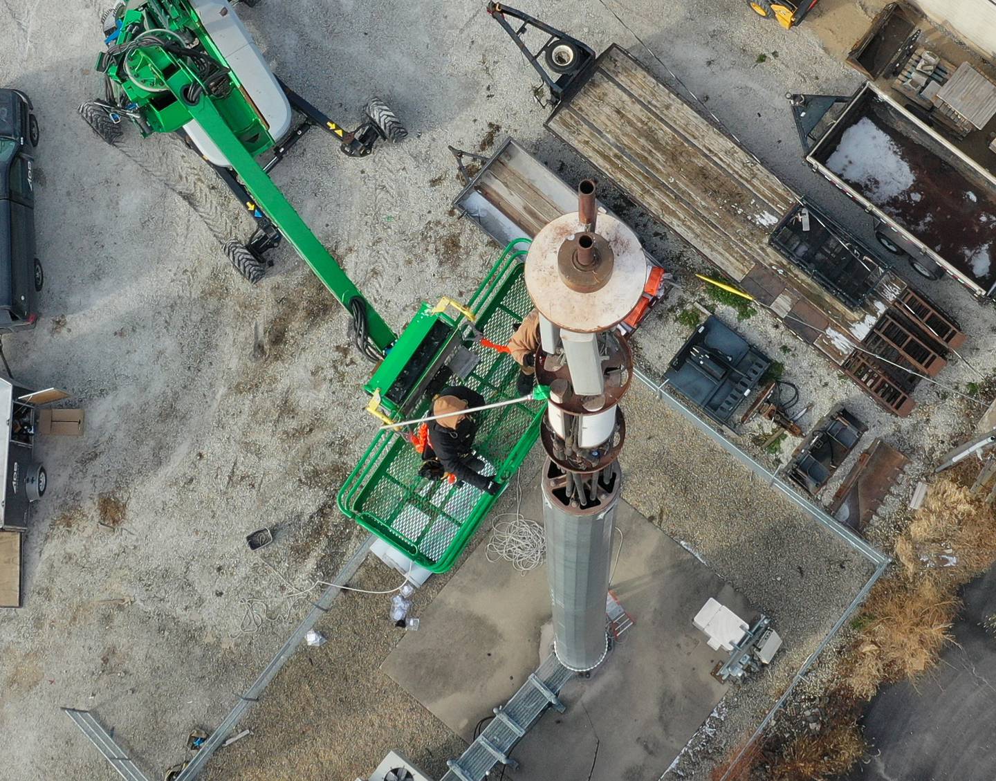 Workers from ADB Companies install 5G on top of a cellular tower at the corner of Canal and Joliet Streets on Monday, Dec. 19, 2022 downtown La Salle.