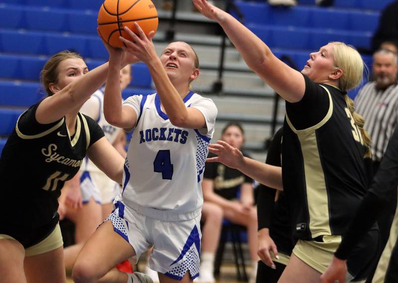 Burlington Central’s Ashley Waslo works under the net ahgainst Sycamore in girls basketball at Burlington Central High School in Burlington on Tuesday, November 18, 2025.