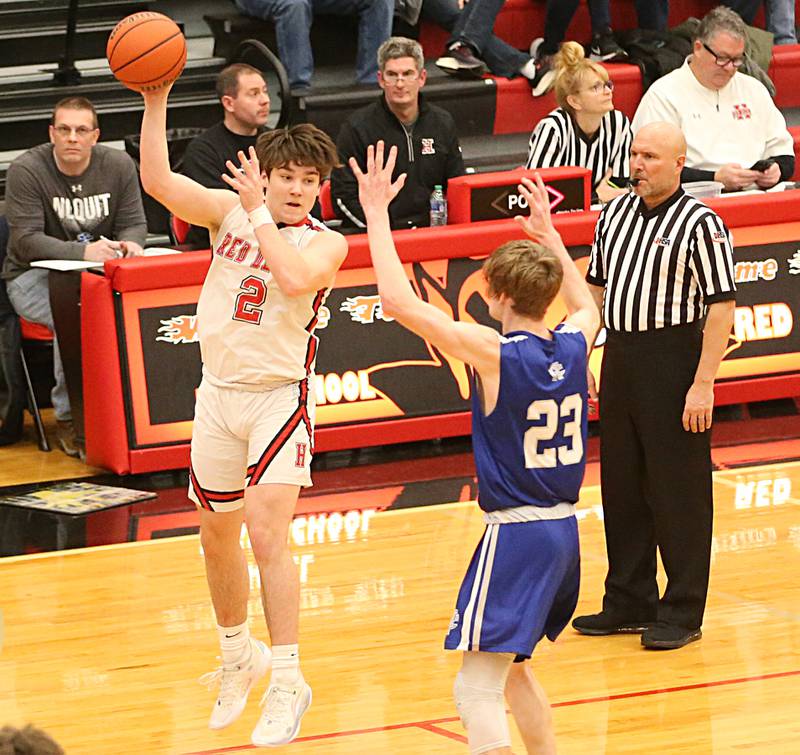 Hall's Ashton Pecher looks to pass the ball over Newman's Lucas Simpson on Friday, Feb. 3, 2023 at Hall High School.