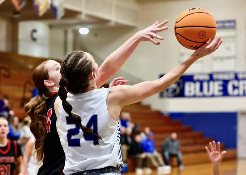 Princeton's Keighley Davis tries a reverse layup against E-P's Brynn Brown Tuesday night at Prouty Gym. The visiting Panthers won 51-40.