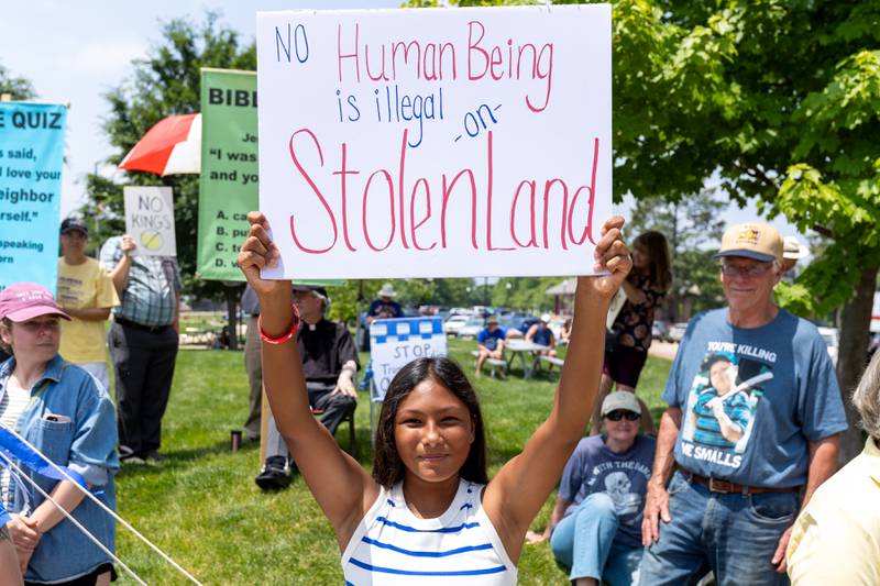 Protester holds sign at the “No Kings” protest on Saturday, June 14, 2025 at Rotary Park in Princeton.
