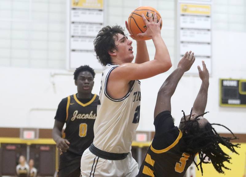 Cary-Grove’s Brady Elbert powers his way to the hoop against Jacobs during Hinkle Holiday Classic varsity boys basketball tournament action on Thursday, Dec. 26, 2024 at Jacobs High School in Algonquin.