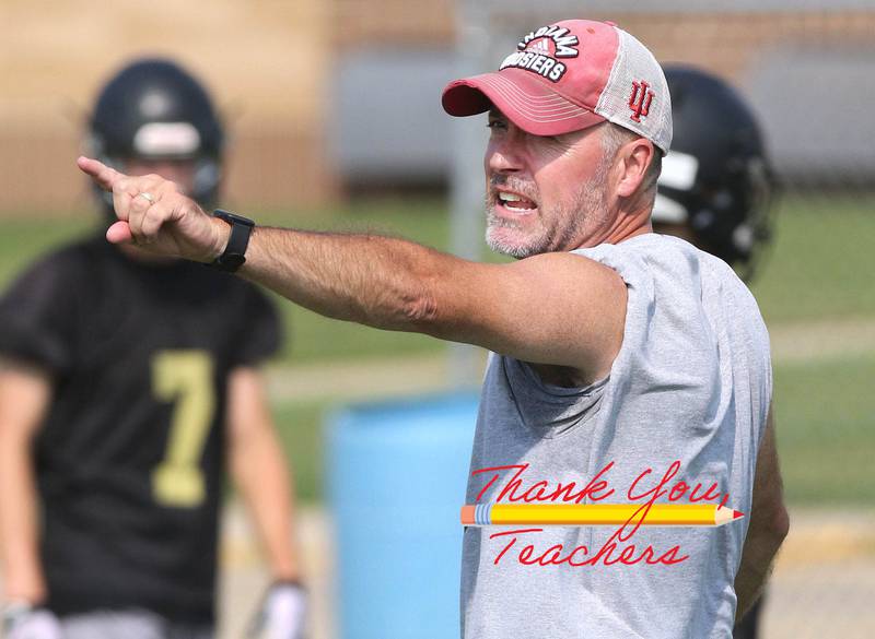 Sycamore High School football head coach Joe Ryan gives instruction to his team Tuesday, Aug. 10, 2021, during practice at the school.
