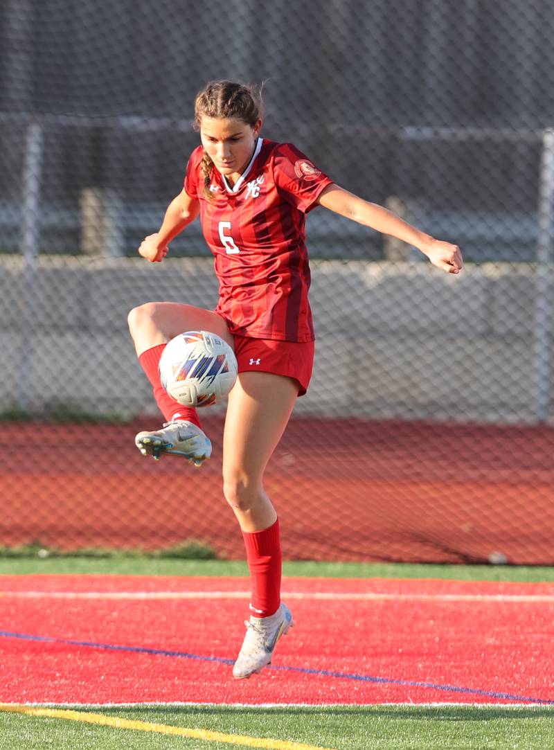 Hinsdale Central's Julia Marinaccio (6) goes up for the ball during the girls varsity soccer match between Lyons Township and Hinsdale Central high schools in Hinsdale on Tuesday, April 18, 2023.