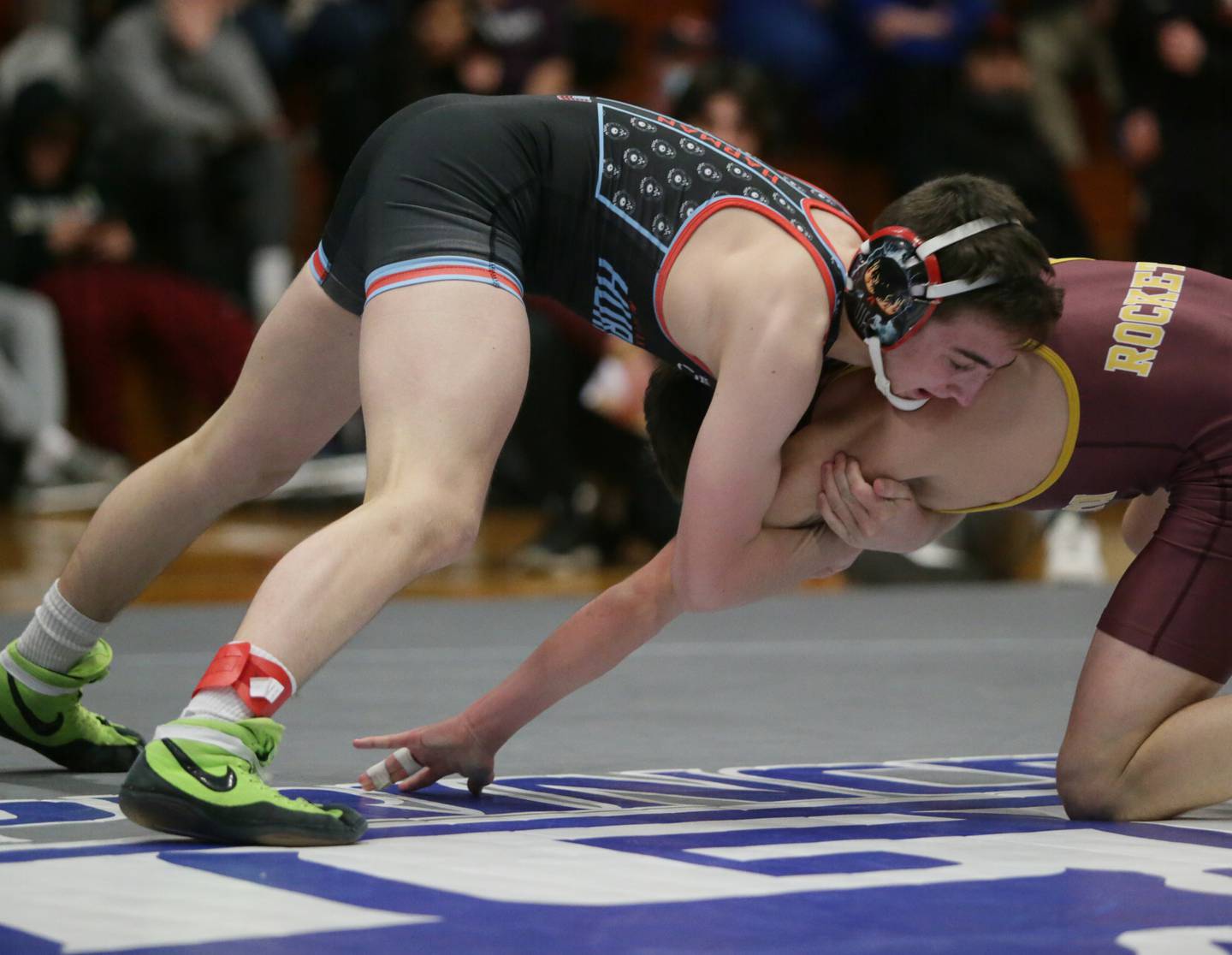 Marian Central Kaden Harman, wrestles Richmon-Burton's Emmet Nelson, in the 113 weight class at the Class 1A wrestling Sectional meet on Saturday Feb. 12, 2022 in Princeton