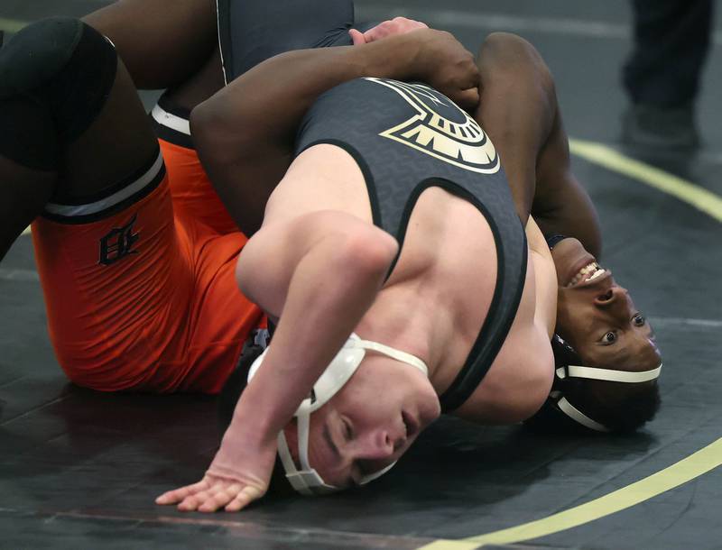 DeKalb’s Malik Warren (right) wrestles Sycamore’s Ian Ruiz during their 175 pound match Friday, Jan. 16, 2026, at Sycamore High School.