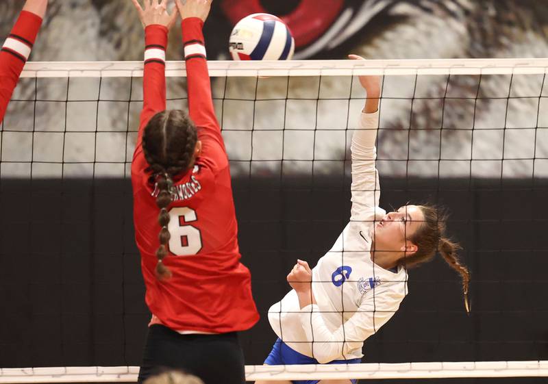 Hinckley-Big Rock's Courtlyn Brockway tries to spike the ball by Indian Creek's Isabella Turner during their match Tuesday, Sept. 19, 2023, at Indian Creek High School in Shabbona.