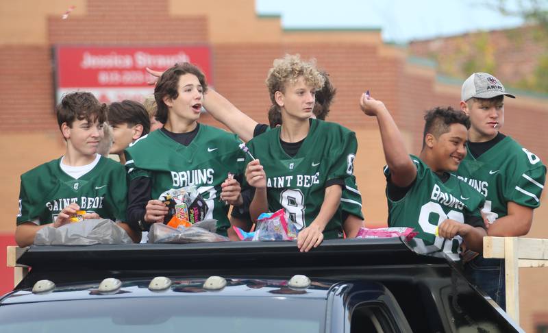 St. Bede football players ride on a a float during the St. Bede Homecoming parade on Friday, Sept. 27, 2024 downtown Peru.