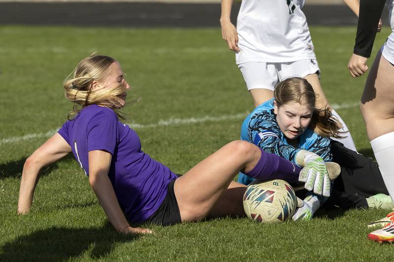 Dixon’s Micki Worrell battles the North Boone goalie for the ball Tuesday, April 15, 2025.