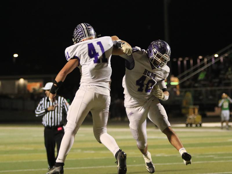Rochelle's Roman Villalobos (40) and Tyler Gensler (41) celebrate a play during Friday's Class 4A first-round playoff game at Geneseo.