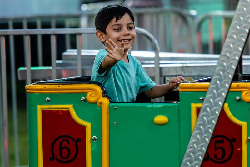 Joliet resident Alan Alcala rides a train during Taste of Joliet on June 21, 2025.
