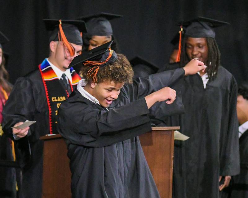 DeKalb High School senior Joseph Mitchell shows off some dance moves after collecting his diploma on Saturday, May 24, 2025, during the Class of 2025 Commencement ceremony held at the NIU Convocation Center in DeKalb.