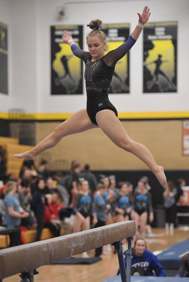 Geneva's Maura Anderson on the balance beam at the Hinsdale South girls gymnastics sectional meet in Darien on Tuesday, February 7, 2023.