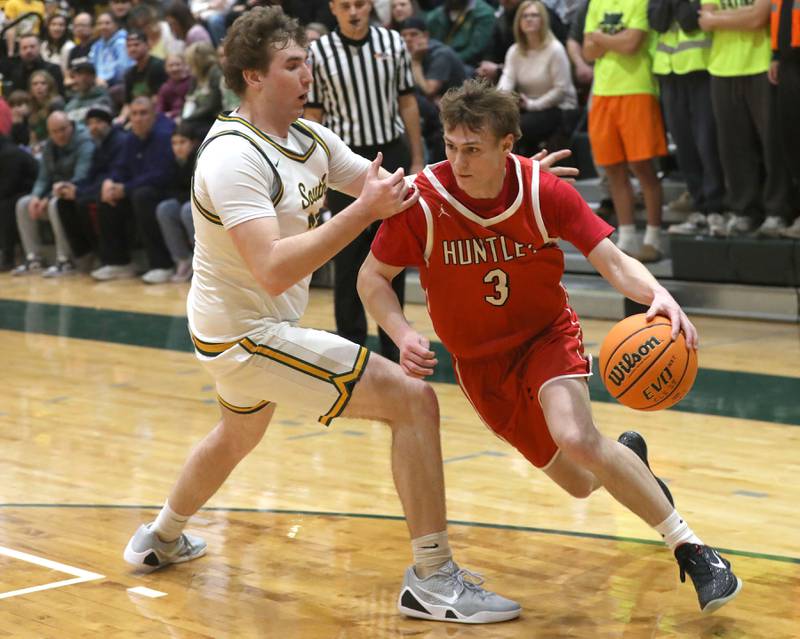 Huntley's Aidan Gibbs tries to drive the baseline against Crystal Lake South's Ryan Morgan during a Fox Valley Conference boys basketball game on Friday, Jan. 30, 2026, at Crystal Lake South High School.