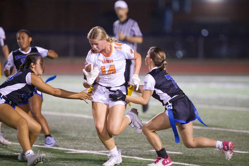 St. Charles East's Brynn Maple looks to avoid St. Charles North's Emma West (24) and Aubrey Underkofler (7) on Monday, September 29, 2025 in St. Charles.