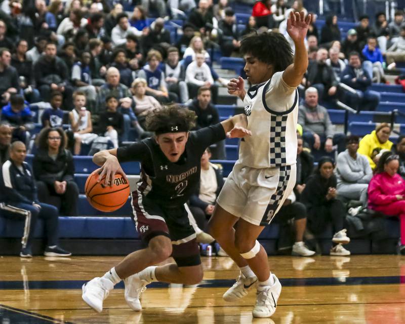 Plainfield North's Jaxson Perez (2) makes a move with the ball during their basketball game between Plainfield North at Oswego East Friday, Dec 5, 2025 in Oswego.