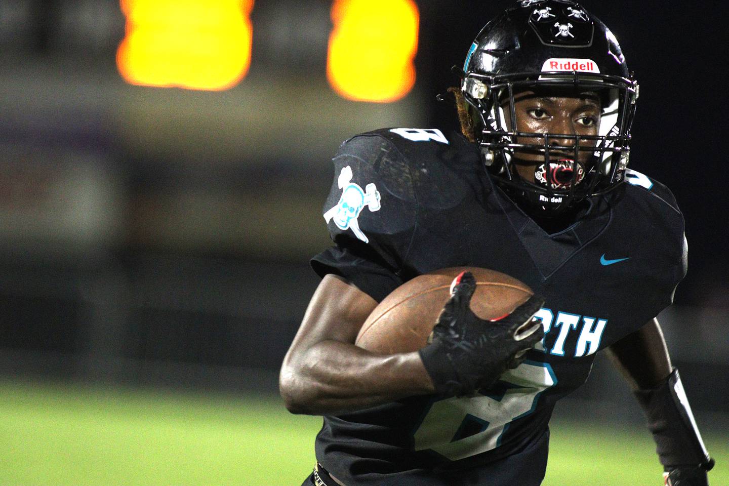 Woodstock North’s Max Dennison runs the ball against Woodstock in varsity football at Woodstock North Friday night.