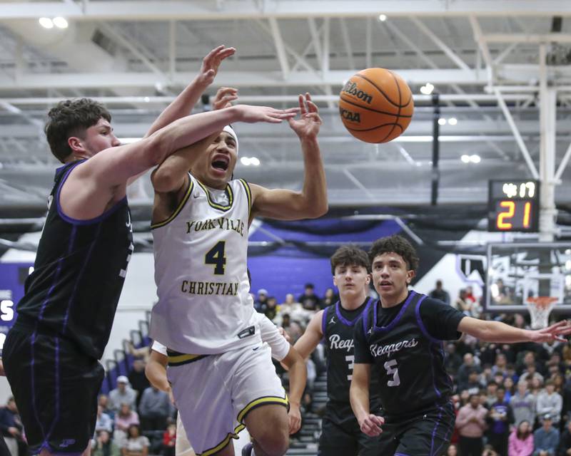 Yorkville Christian's Tray Alford (4) is fouled on a drive to the basket during their Plano Christmas Classic semi-final basketball game between Yorkville Christian at Plano Monday, Dec 29, 2025 in Plano.