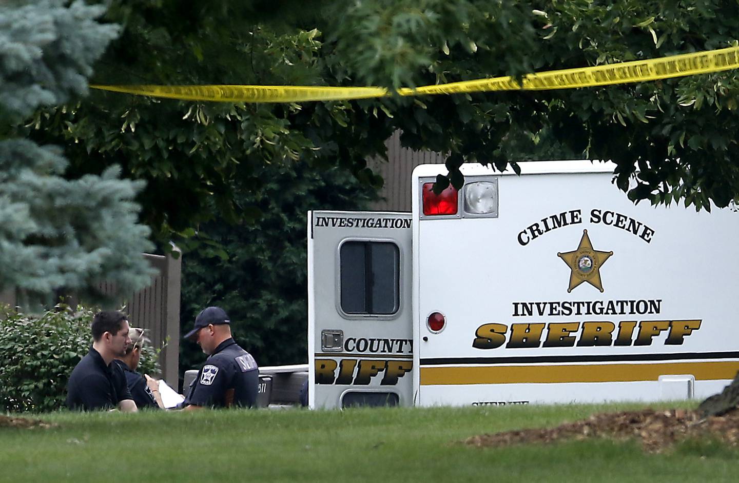 Officers from the McHenry County Sheriff and other departments investigate a shooting in the 5800 block of Wild Plum Road in unincorporated Crystal Lake Wednesday Aug. 9, 2023. The department was called to the scene at around 3:50 a.m. for reports of multiple gunshots fired. according to Tim Creighton, from the sheriff’s department five people were found at the home. Three women were deceased, a women, and man were transported to the hospital where the man later died.