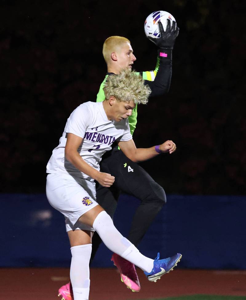 Coal City's Carter Nicholson makes a save as Mendota's Isaac Diaz tries to make a play Thursday, Nov. 6, 2025, during their Class 1A state semifinal game at Hoffman Estates High School.