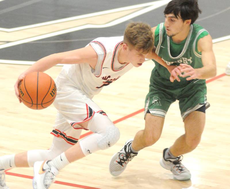 Woodland's Tucker Hill dribbles past Dwight's Will Trainor at the Warrior Dome on Friday, Jan. 13, 2023.