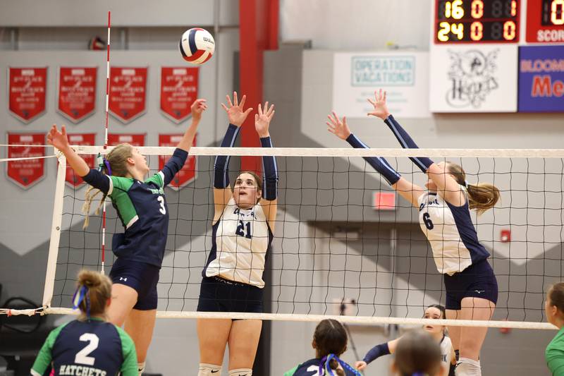 Cissna Park's Lauryn Hamrick, center, and Marina Day jump to block a hit during the Timberwolves' victory in two sets, 25-22, 25-11, over Windsor/Stewardson-Strasburg in the IHSA Class 1A Heyworth Super-Sectional on Monday, Nov. 10, 2025.