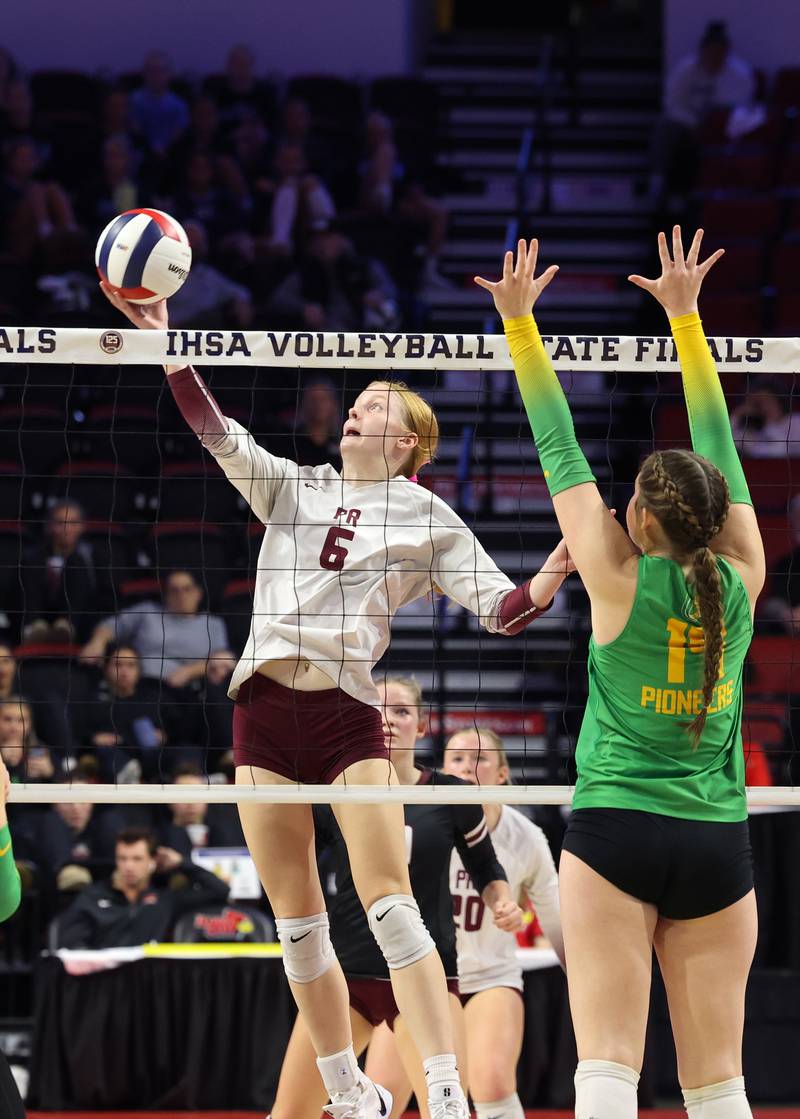 Prairie Ridge's Sonora Bekere tips the ball over the net during the Wolves' loss in two sets, 25-20, 25-18, in the IHSA Class 3A State semifinals on Friday, Nov. 14, 2025.