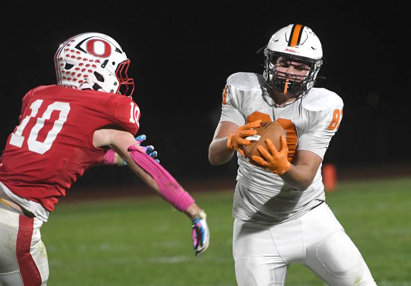 Winnebago's Lincol Asprooth catches a pass as Oregon's Keaton Salsbury (10) defends on Friday, Oct. 17, 2025 at Landers-Loomis Field in Oregon.