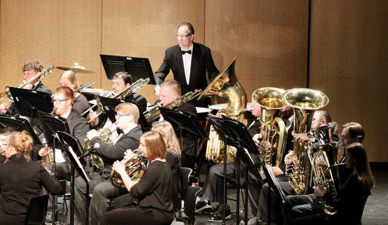 The brass section, backed by a timpani player performs Andrew Boysen Jr.'s "Kirkpatrick Fanfare" as part of the opening number of the Sterling Municipal Band's Spring Concert on Wednesday at Centennial Auditorium.