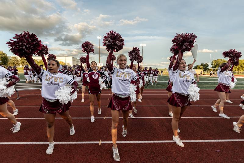 Lockport’s varsity cheer team shares team spirit during the varsity football game between Lockport and Lincoln-Way West on Sept. 5, 2025.