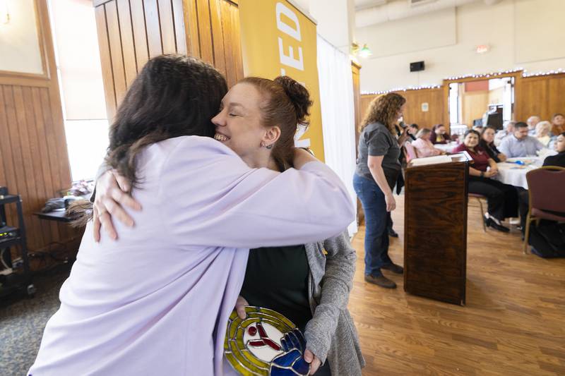 Vanessa Wessels (right) hugs Lee County United Way Executive Director Ashley Richter Thursday, May 1, 2025, after receiving the Rising Star of the Year award for her work on the 2024-25 campaign.