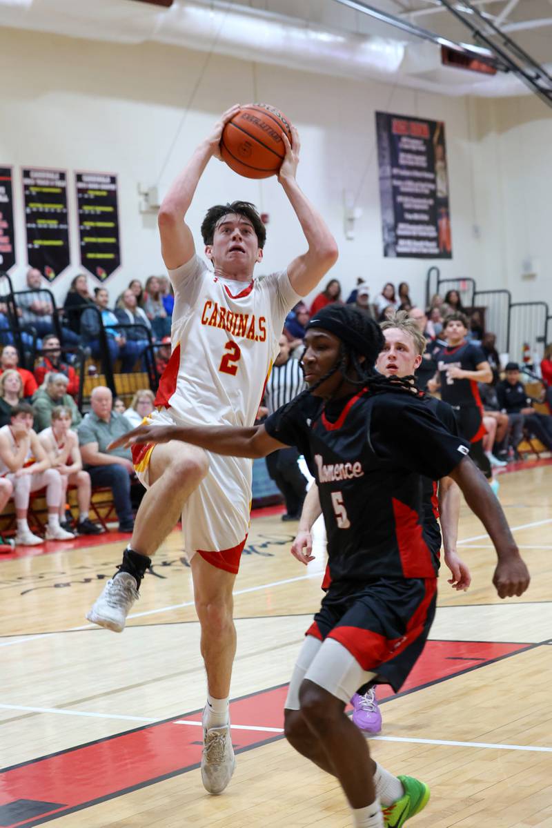 St. Anne's Matthew Langellier goes for a layup past Momence's Aiden Smith during St. Anne's 64-43 victory in the River Valley Conference semifinals on Tuesday, Feb. 10, 2026.