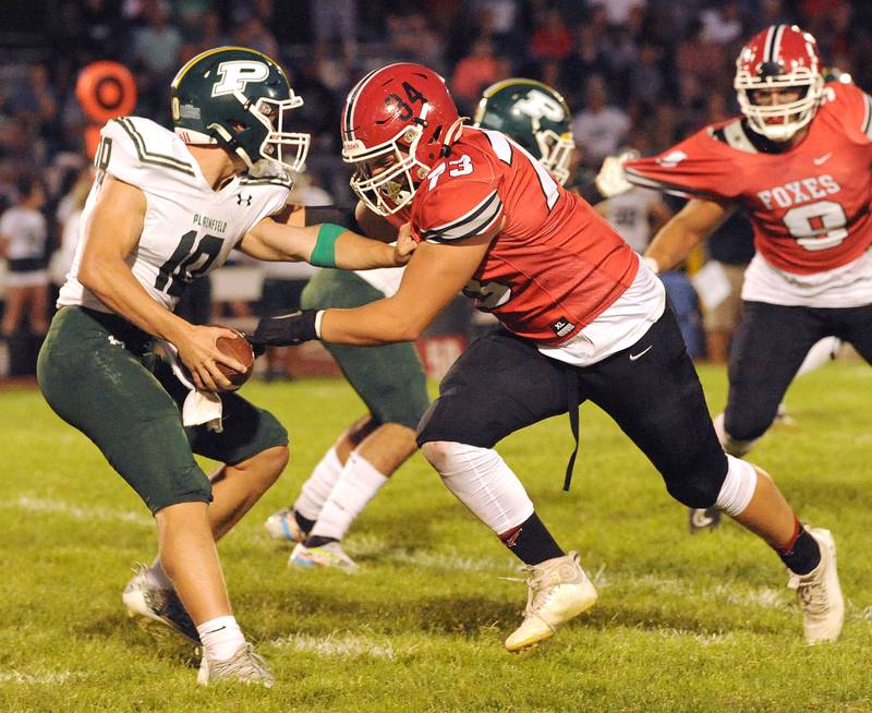 Yorkville defensive lineman Andrew Zook (34/73) sacks Plainfield Central quarterback Chase Vayda (10) during a varsity football game at Yorkville High School on Friday, Sep. 2, 2022.