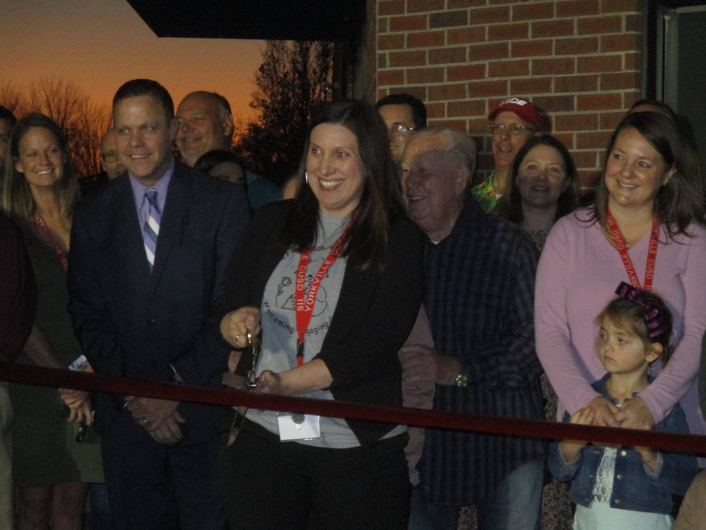 Yorkville School District Y115 Early Childhood Program Coordinator Cory Mehnert cuts the ribbon on the new facility on Nov. 9, 2022. Standing next to Mehnert is school Superintendent Tim Shimp.