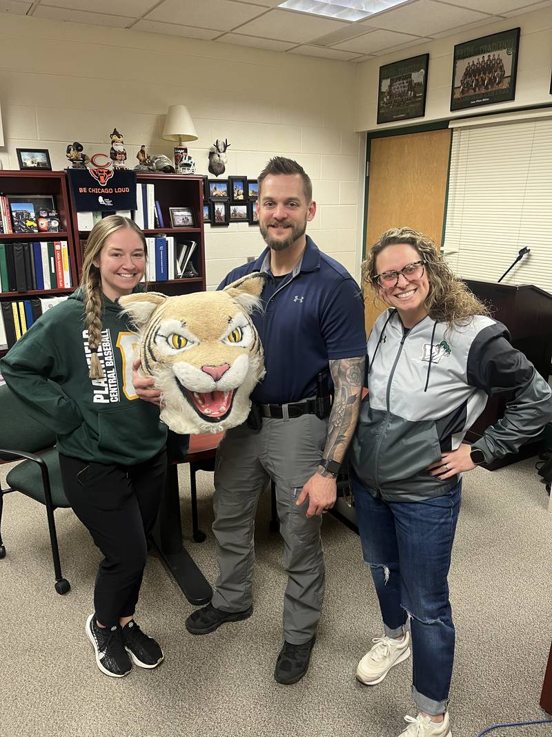 Plainfield Police Officer Dean Klier (center) after receiving the Wildcat Award at Plainfield Central High School. Klier is serving as a school resource officer for students and staff at the academic building.