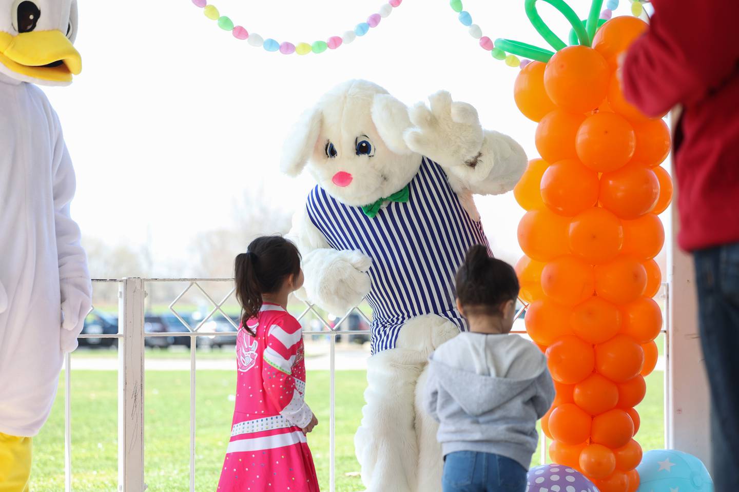 The Easter Bunny waves to young visitors following the annual Easter Egg Hunt at Perry Farm Park on Saturday, April 12, 2025.