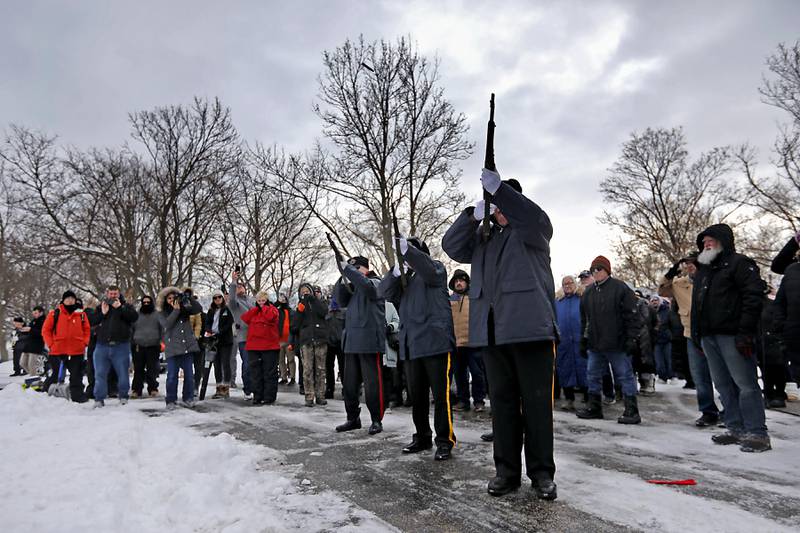 Members of the Combined Veterans’ Organizations Honor Guard fire a three gun salute during McHenry's Wreath Laying Ceremony in honor of fallen veterans on Friday, Dec. 5, 2025,, at St. Mary's Catholic Cemetery in McHenry. The event was hosted by McHenry American Legion Post 491 and Team Home Depot.