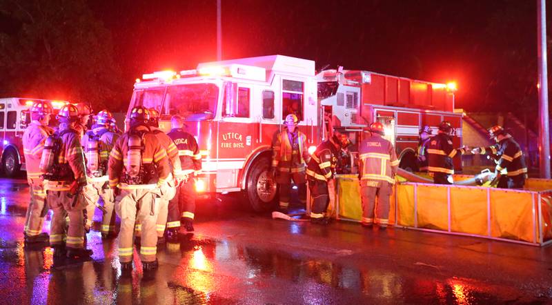 Firefighters fill tender boxes at Walnut and 5th Streets to fight a fire across from the Westclox building on Friday, July 14, 2023 in Peru. The fire began at 8:19p.m. A MABAS box alarm was issued to the fourth level and then brought back down after the fire was contained.