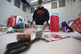 Photos: Volunteers wrap gifts for Blue and Red Christmas for Kids in Peru