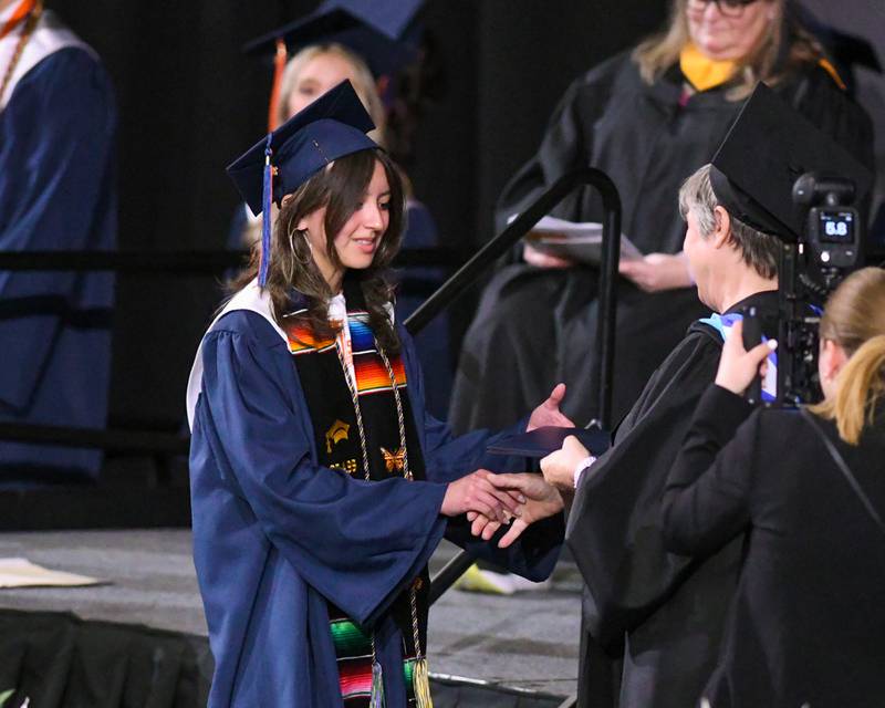 Oswego High School graduates make their way down to Victory Court gym to get last minute instructions before the graduation ceremony on Saturday May 17, 2025, held at the Convocation Center in DeKalb.